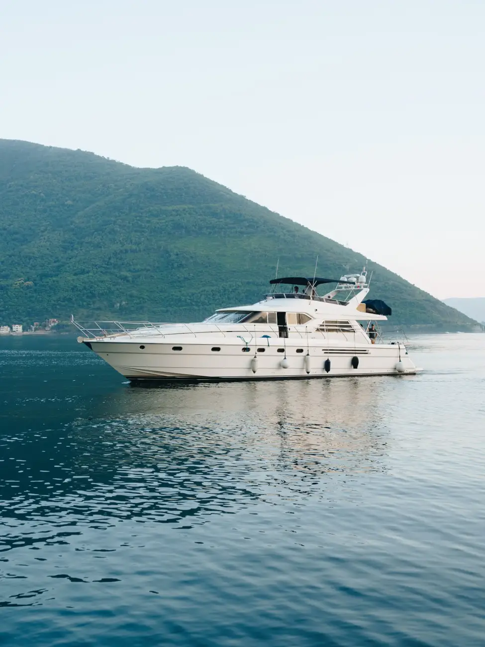 white-cruise-yacht-water-near-mountains-montenegro white-cruise-yacht-water-near-mountains-montenegro
